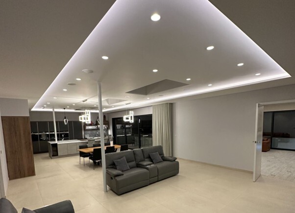 Modern home ceiling with recessed lighting showing where fire rated downlights may be installed.