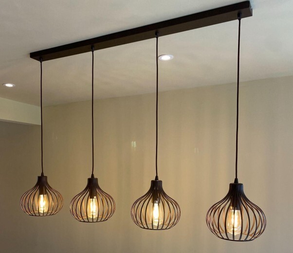  Modern pendant lighting in a dining area illustrating halogen or LED lights for the home. 